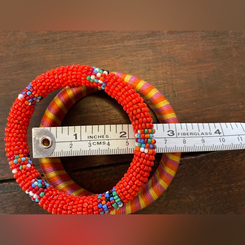 Set of 2 orange & yellow bangles.